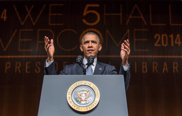 Barack Obama speaking from on a podium 