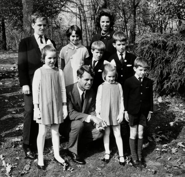 Black and white photo of Ethel and Robert Kennedy with some of their children at the Bronx Zoo.