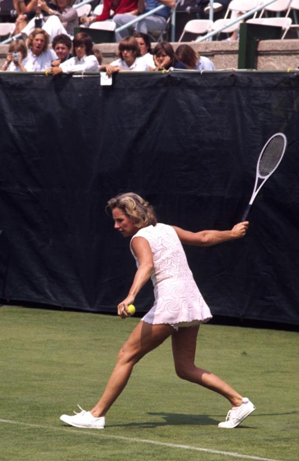 Action photo of Ethel Kennedy playing tennis.