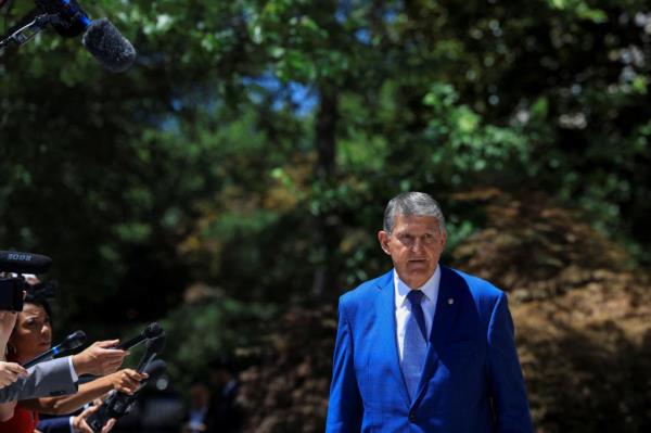 U.S. Sen. Joe Manchin (I-WV) enters a caucus lunch to receive a briefing from President Biden's campaign advisors 