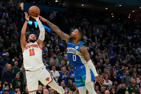 Jalen Brunson shoots while being defended by Damian Lillard during the Knicks' loss to the Bucks on Nov. 3. 