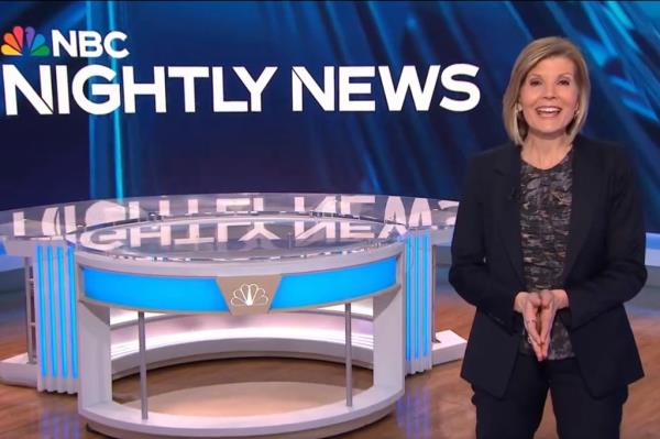 Kate Snow standing in front of NBC news studio.