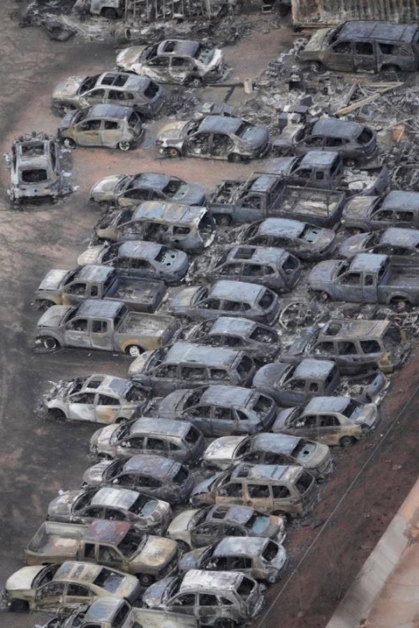 Wildfire wreckage is shown Thursday, Aug. 10, 2023, in Lahaina, Hawaii. The search of the wildfire wreckage on the Hawaiian island of Maui on Thursday revealed a wasteland of burned out homes and obliterated communities as firefighters battled the stubborn blaze making it the deadliest in the U.S. in recent years. (AP Photo/Rick Bowmer)