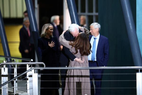 Assange kisses his wife Stella after landing in Australia on Wednesday.