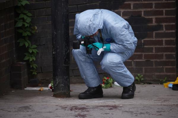 Police at the scene of the stabbing.