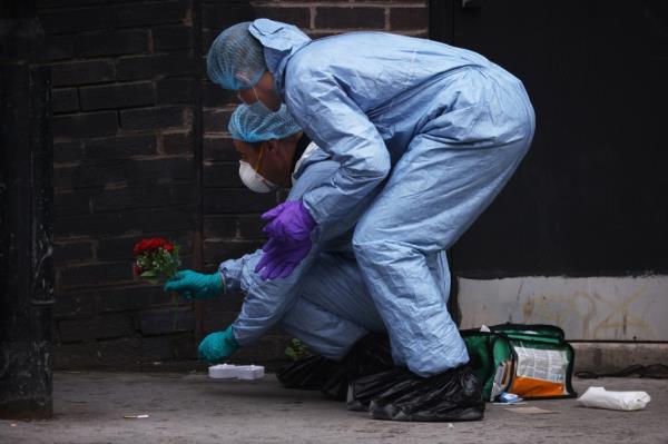 Police forensic officers at the scene of a fatal stabbing of a 15-year-old girl in Croydon.