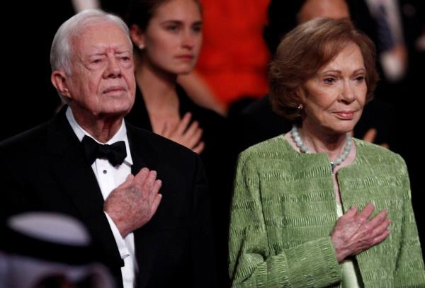 Former U.S. President Jimmy Carter and his wife Rosalynn attend the 