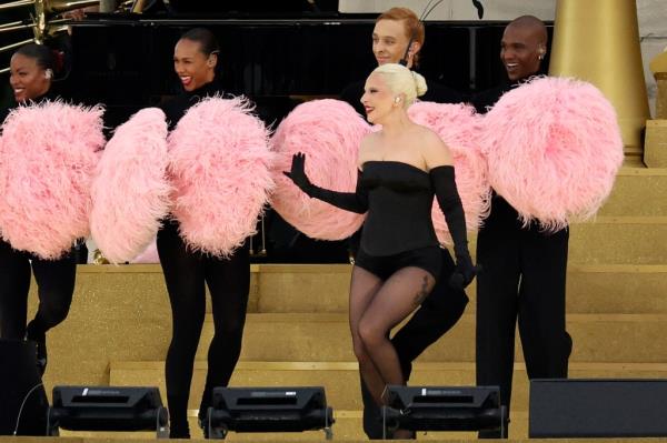 Lady Gaga and feather wielding dancers