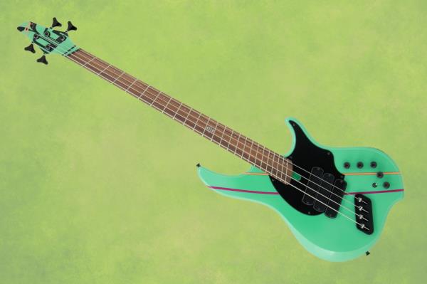 A green electric guitar on an abstract grunge texture panoramic background