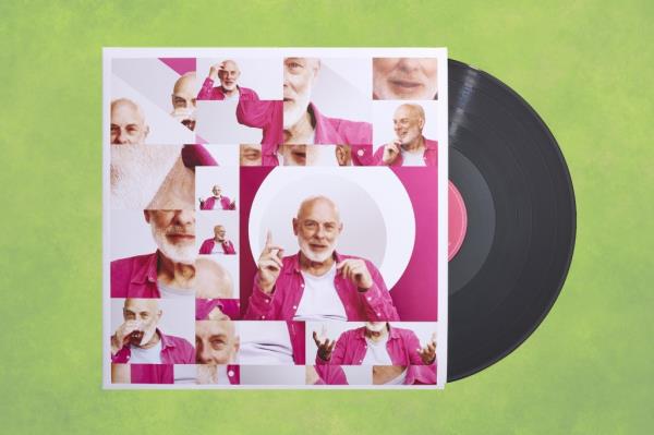 Brian Eno's face repeatedly shown on a green abstract grunge panoramic record cover