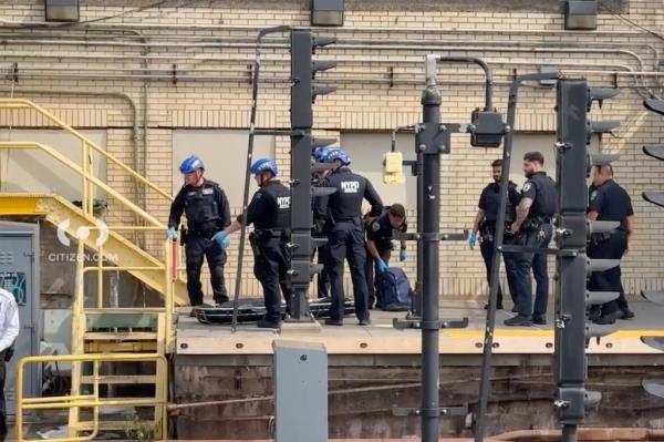 Respo<em></em>nders from the NYPD ready with a stretcher at the Smith-Ninth St. Station in Brooklyn on Mo<em></em>nday morning 