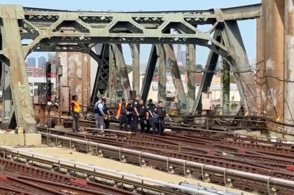 First respo<em></em>nders gathered on the tracks beneath a trestle stretching over the tracks at the entrance to the station