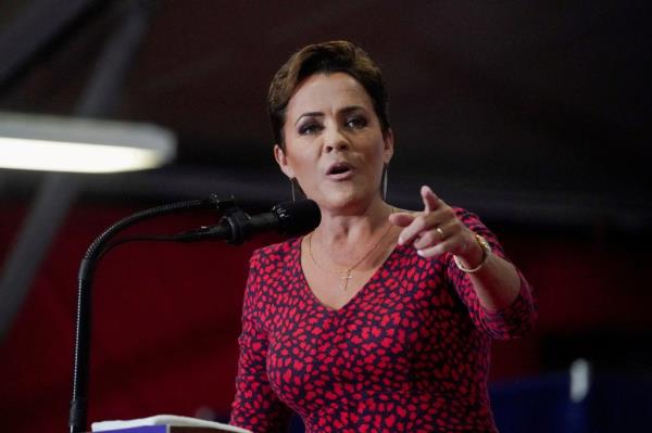 Arizona Republican U.S. Senate candidate Kari Lake speaking into a microphone at a rally held by Senator JD Vance in Glendale, Arizona on July 31, 2024.