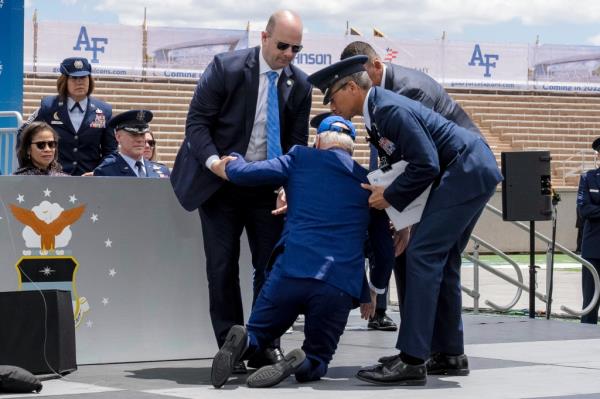 Biden getting helped back to his feet by Secret Service and Air Force officials.