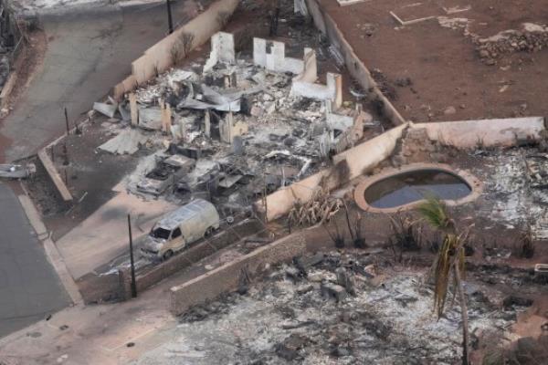 Wildfire wreckage is shown Thursday, Aug. 10, 2023, in Lahaina, Hawaii. The search of the wildfire wreckage on the Hawaiian island of Maui on Thursday revealed a wasteland of burned out homes and obliterated communities as firefighters battled the stubborn blaze making it the deadliest in the U.S. in recent years. (AP Photo/Rick Bowmer)