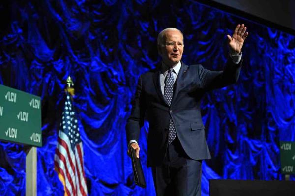 US President Joe Biden waves as he walks away after speaking during the League of Co<em></em>nservation Voters Annual Capital Dinner, at The Anthem in Washington, DC, on June 14, 2023.