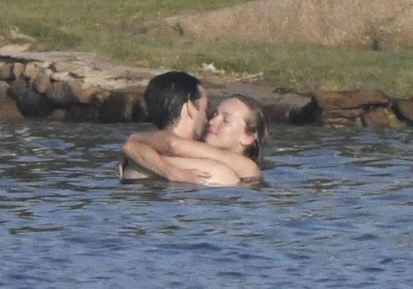 The pair packed on the PDA Wednesday at a private beach.