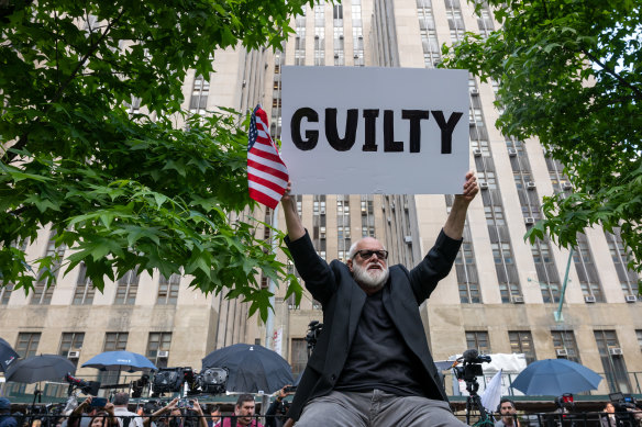 People celebrate after former president Do<em></em>nald Trump was found guilty on all counts at Manhattan Criminal Court on Thursday.