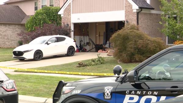 Police car parked in front of a house in Canton following a dispute