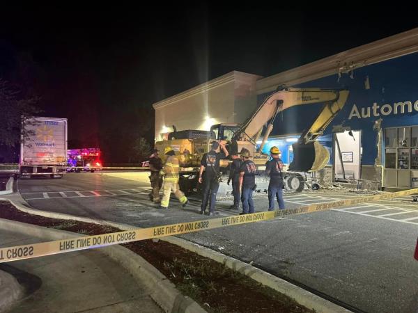 After crashing into the south side of the retail store, Smith fled the excavator and ran inside armed with a machete, but discarded it.