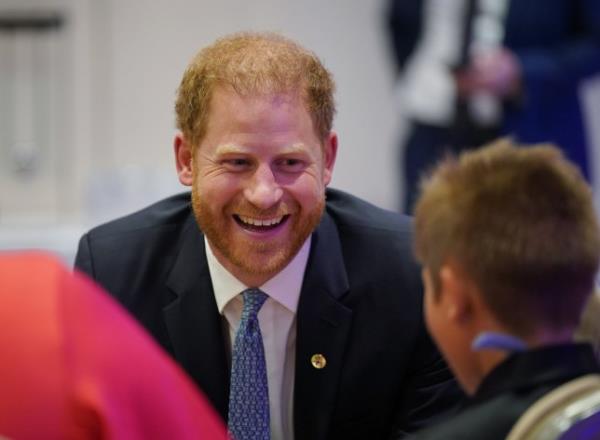 The Duke of Sussex speaks to George Hall and mum Hollie Pearson, during the annual WellChild Awards 2023, at the Hurlingham Club in London. 