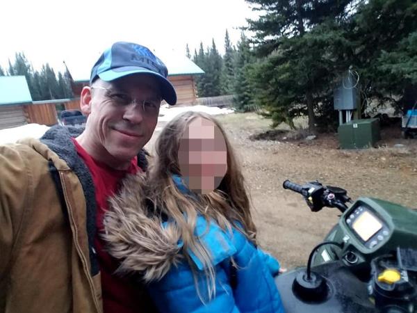 The teen's father, Todd Kolstad, seen with the child's face blurred