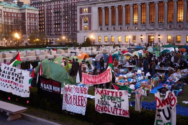 Pro-Palestinian demo<em></em>nstrators gather at an encampment on the lawn of Columbia University.