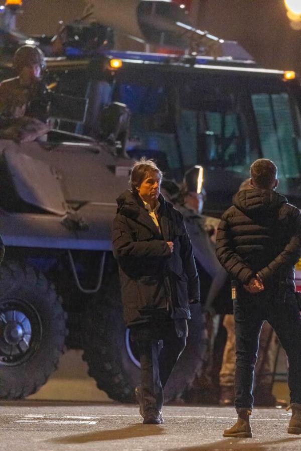 Many of the extras, who were dressed as members of the army,  were also spotted carrying prop guns as they milled around several army jeeps waiting for their next take. 