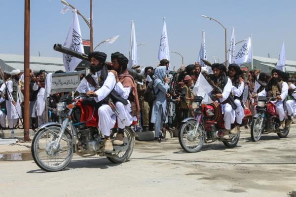 Taliban military perso<em></em>nnel riding motorbikes in a military parade in Ghazni, Afghanistan on Aug. 14, 2024.