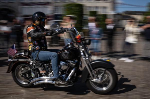 Motorcycle rider participating in a parade of 250 Harley-Davidson motorbikes in Isigny-sur-Mer, Normandy, commemorating the 80th anniversary of the D-Day landings