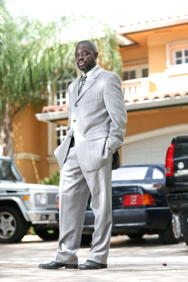 Louima outside his luxury home in Miami. 