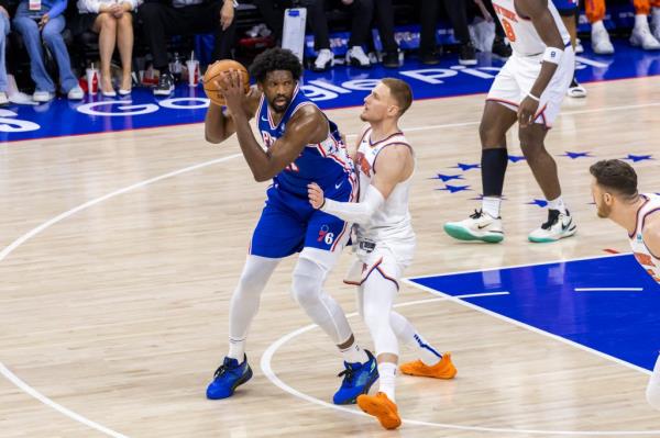 Do<em></em>nte DiVincenzo #0 of the New York Knicks is miss matched as he defends against Joel Embiid #21 of the Philadelphia 76ers