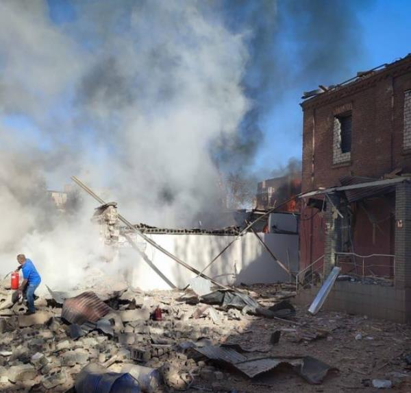 epa10847751 A handout photo made available by the Head of Dnipropetrovsk Regio<em></em>nal Administration, Serhiy Lysak, via telegram shows a person trying to extinguih a fire at the site of a missile strike in Kryvyi Rih, Dnipropetrovsk region, central Ukraine, 08 September 2023, amid the Russian invasion. A policeman was killed and at least 25 others were injured as a result of a Russian missile strike targeting one of the police administration buildings in Kryvyi Rih on 08 September, Ukraine's Minister of Internal Affairs, Ihor Klymenko wrote on telegram. EPA/DNIPROPETROVSK REGIo<em></em>nAL MILITARY ADMINISTRATION HANDOUT -- BEST QUALITY AVAILABLE -- MANDATORY CREDIT: SERHIY LYSAK, DNIPROPETROVSK REGIo<em></em>nAL MILITARY ADMINISTRATION -- HANDOUT EDITORIAL USE ONLY/NO SALES