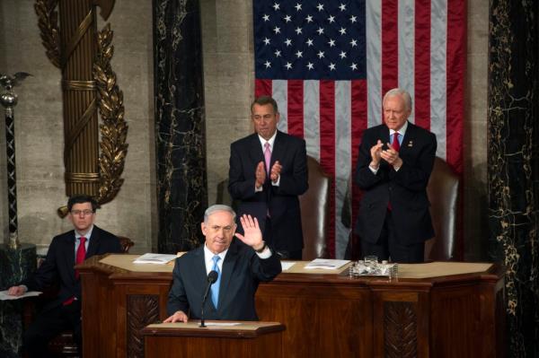 Israeli Prime Minister Benjamin Netanyahu (L) delivers a speech to a joint meeting of Co<em></em>ngress on the floor of the US House of Representatives, in front of US House Speaker Republican John Boehner (C) and Republican Senator from Utah Orrin Hatch (R) in the US Capitol in Washington, DC, USA, 03 March 2015.