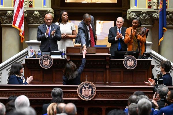 Gov. Kathy Hochul shakes the hand of Lieutenant Gov. Anto<em></em>nio Delgado before her 2023 state of the state address.