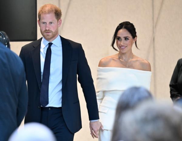 Britain's Prince Harry, The Duke of Sussex, left, and Meghan, Duchess of Sussex, participate in The Archewell Foundation Parents' Summit 