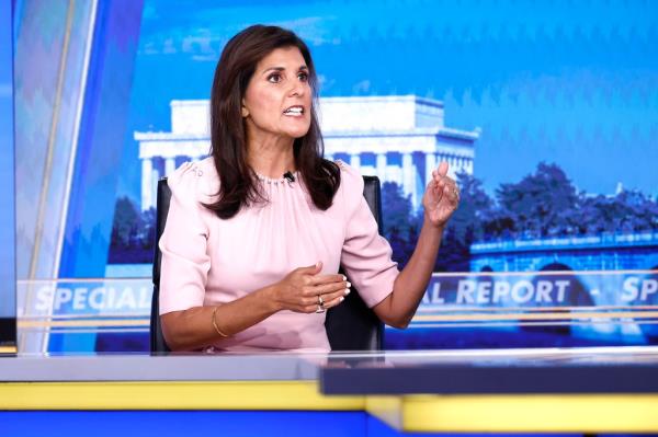 Former Republican presidential candidate Nikki Haley sitting at a desk during her visit to 'Special Report with Bret Baier' at FOX News D.C. Bureau in Washington, DC.