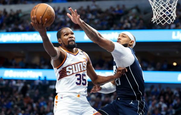 Phoenix Suns forward Kevin Durant (35) shoots past Dallas Mavericks center Daniel Gaffor<em></em>d (21) during the third quarter at American Airlines Center. 