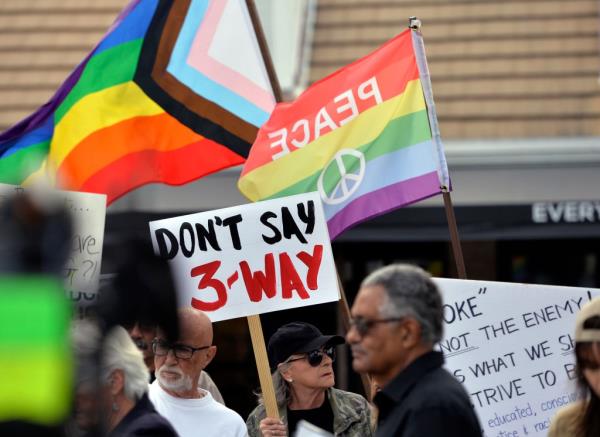 Protesters, including Judy Nadler of Sarasota, holding a 