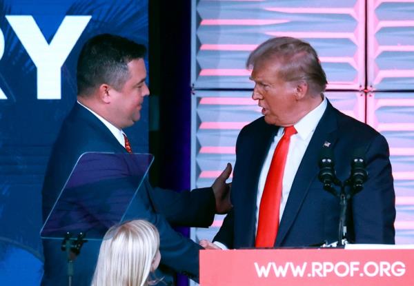 Republican Party of Florida chairman Christian Ziegler, left, greets former president Do<em></em>nald Trump at the RPOF Freedom Summit on Nov. 4, 2023, in Kissimmee, Florida