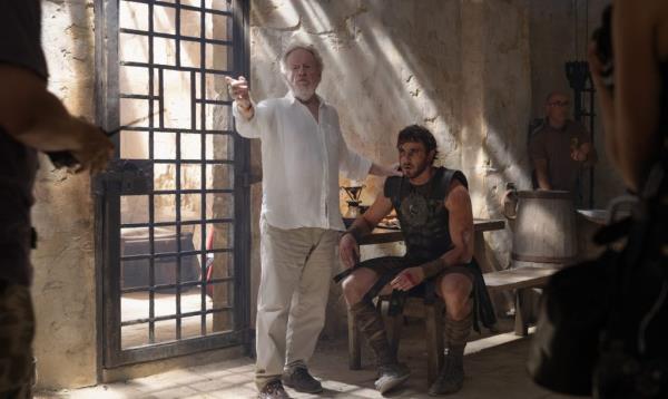 Director Ridley Scott discussing with actor Paul Mescal on the set of the movie Gladiator II