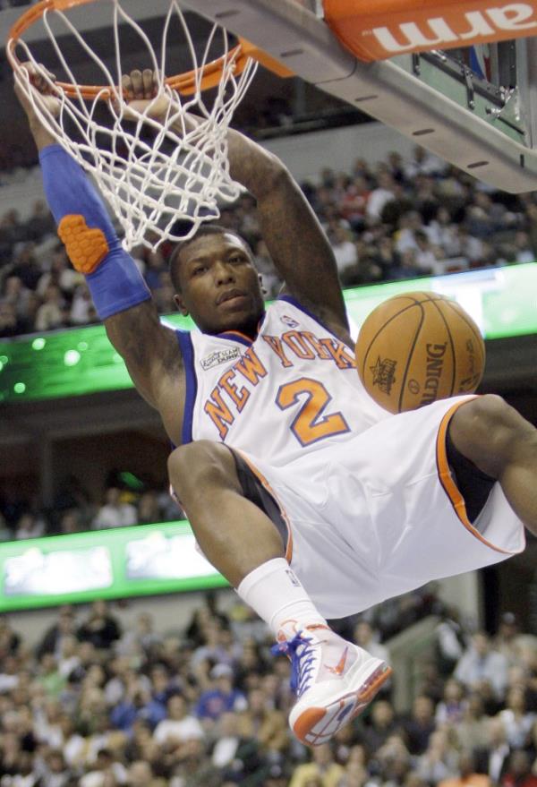 New York Nicks Nate Robinson dunks during the slam dunk co<em></em>ntest during the NBA basketball All-Star Saturday Night on Saturday, Feb. 13, 2010, in Dallas. 