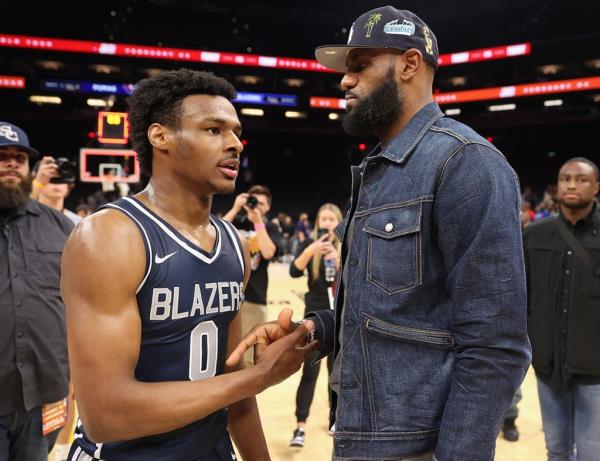 Sierra Canyon Trailblazers guard Bro<em></em>nny James is greeted by his father and NBA star LeBron James after defeating the the Perry Pumas in the Hoophall West tournament at Footprint Center on December 11, 2021 in Phoenix, Arizona. 