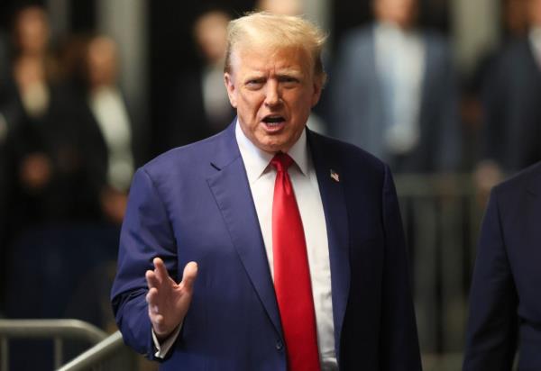 Former President Do<em></em>nald Trump speaks to reporters at Manhattan criminal court, Monday, May 6, 2024 in New York.