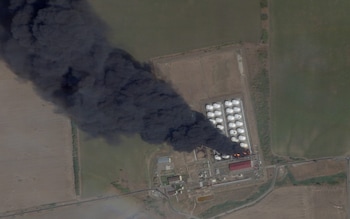 Smoke rises from an oil depot in the Kamensky district in Rostov, southern Russia