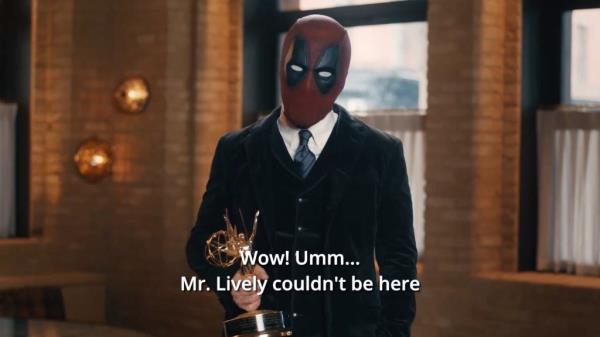 Before the actor can finish, he is cut off by Reynolds, 47, who is dressed in a tux but wearing a Deadpool mask. 