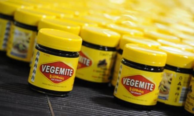 Vegemite rolling along the production line