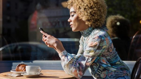 Woman searching on cell phone