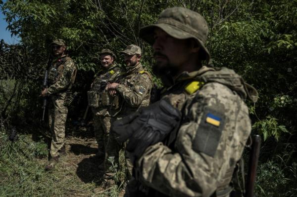 Ukrainian servicemen stands near the Ukraine-Russia border amid Russia's attack on Ukraine, in the Kharkiv region on June 4, 2023. 