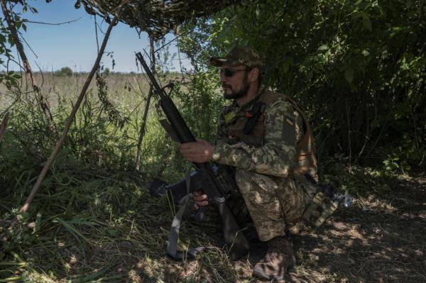 A Ukrainian serviceman looks on near the Ukraine-Russia border, amid Russia's attack on Ukraine, in Kharkiv region, Ukraine, on June 4, 2023.